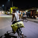 A mine worker carries a bag of coal back home on his bicycle in Korba.